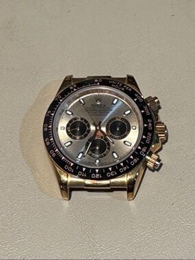 Daytona Men's Watch - Gold Tone Case with Black Bezel and Silver Dial